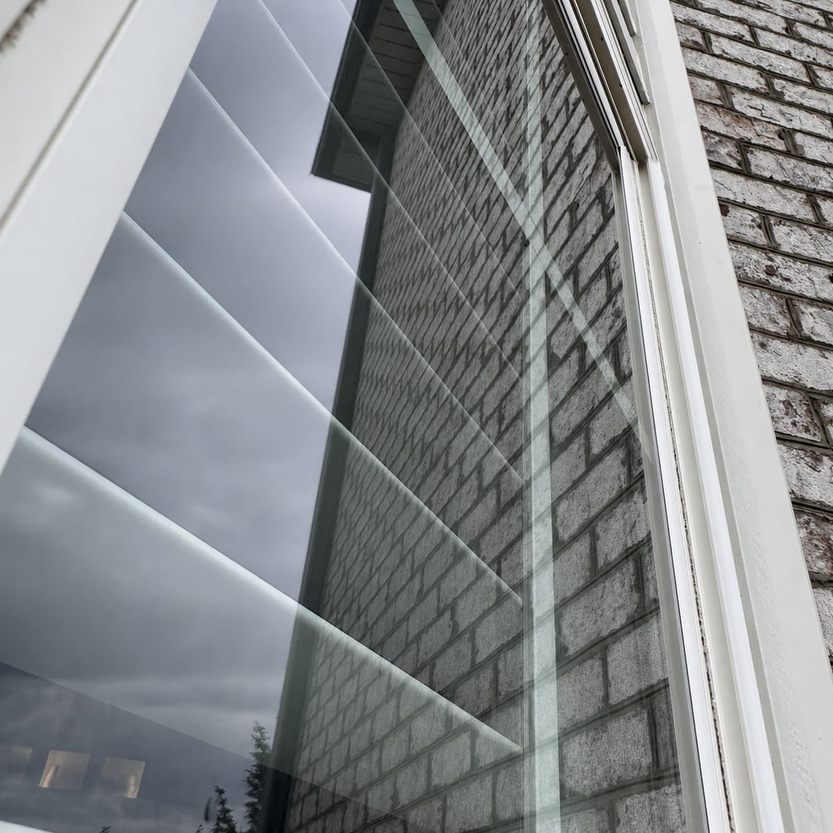 Window glass before cleaning under overcast skies
