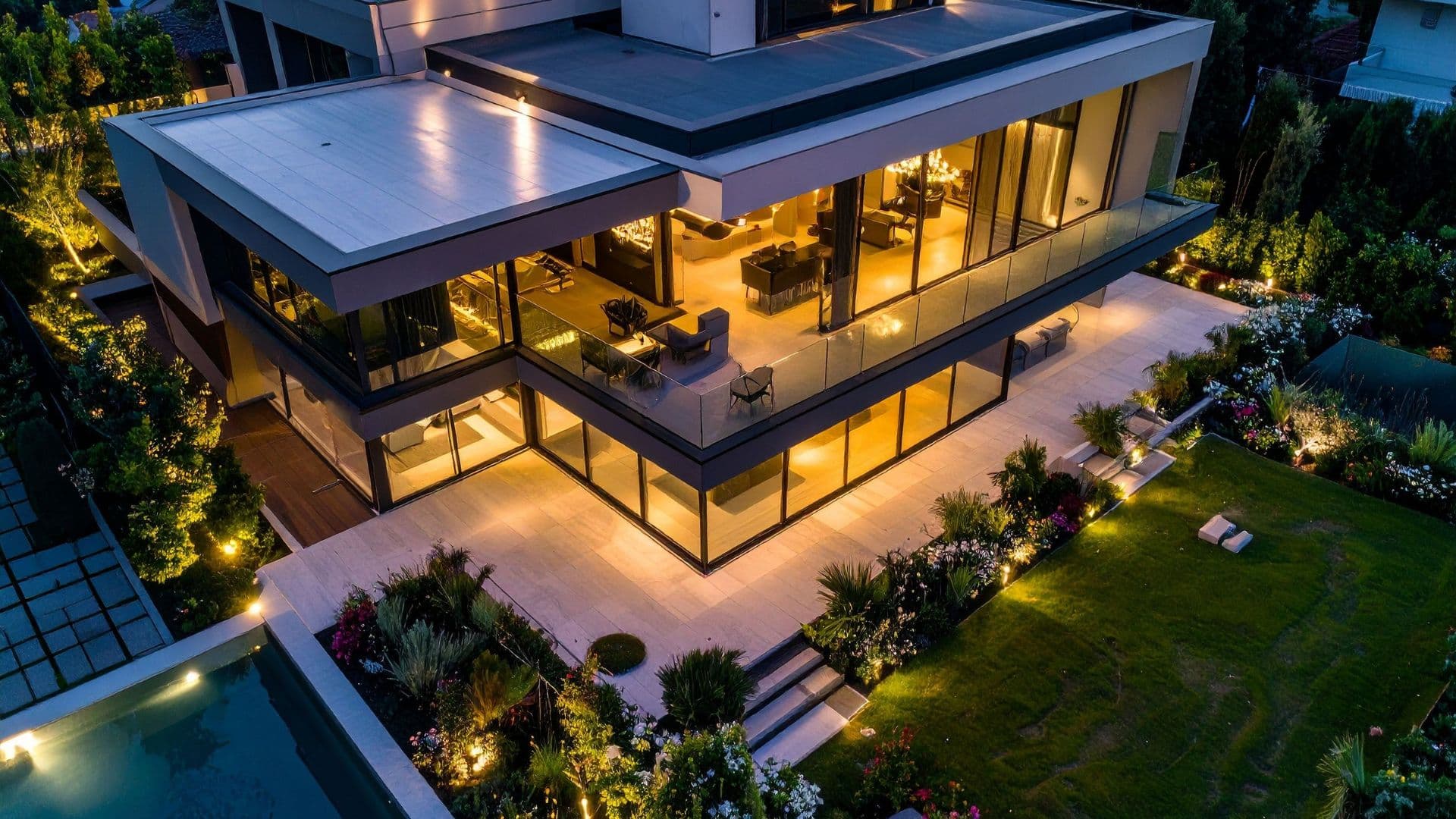 Aerial view of a glass home at dusk in the Central Virginia service area