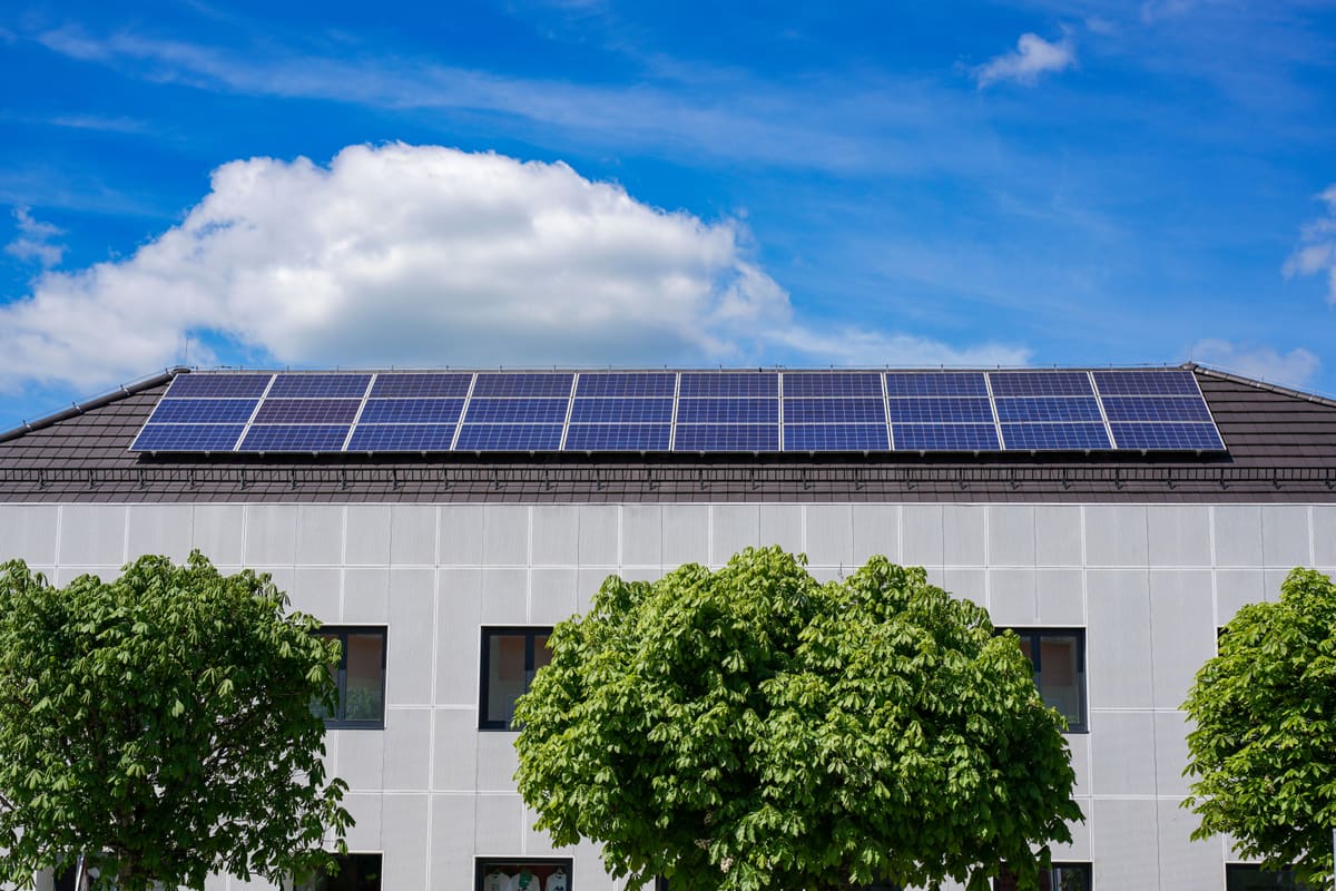 Rooftop solar panel array kept spotless by professional solar panel cleaning service
